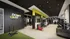 Contemporary gym interior featuring state-of-the-art fitness equipment, vibrant decor, and a motivational 'Don't Quit' wall sign.