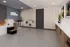 Chic grooming salon interior with playful wall art, modern cabinetry, and a cozy pet bathing area.
