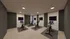 Modern gym facility featuring multiple high-tech exercise bikes with screens, light wood flooring, and sleek ambient lighting.