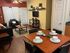 Charming and cozy living room with elegant dining table, stylish seating, and modern decor, perfect for intimate gatherings.