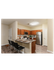 Modern kitchen with stylish wood cabinets, stainless steel appliances, and a chic breakfast bar with seating.