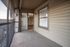 Charming enclosed balcony with sliding glass doors, offering a serene outdoor space connected to the living area.
