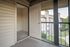 Inviting apartment balcony view with open storage space, offering ample natural light and outdoor charm.