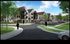 Scenic view of modern apartments with stylish architecture surrounded by lush greenery and a spacious parking area under a bright blue sky.