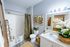 Elegant bathroom with chic botanical decor, soft lighting, and a cozy, modern vibe.
