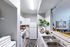 Bright and modern kitchen with sleek appliances, stylish decor, and ample counter space.