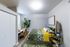 Inviting bedroom with vibrant floral bedding, cozy workspace by the window, and stylish decor accents.