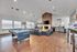 Chic entertainment room featuring a pool table, sleek leather sofas, and modern fireplace, perfect for social gatherings.