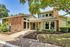 Charming leasing center with modern architecture and lush landscaping, inviting and elegantly designed for a welcoming experience.