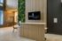 Modern lobby at 865 East with stylish wood paneling, vertical garden, and sleek reception area.
