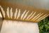 Modern ceiling design with sleek wooden slats and integrated lighting, complemented by a lush vertical garden.