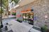 Charming leasing office entrance for texan 26 with modern stone exterior in a tranquil setting.