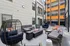 Contemporary apartment courtyard with stylish seating, vibrant accents, and cozy fire pit, perfect for social gatherings.