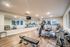 Modern fitness center with state-of-the-art equipment, mirrored walls, and ample natural light for an invigorating workout experience.