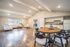 Elegant open-concept living space featuring modern furniture, a chic dining area, and a stylish kitchen with ample storage.