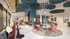 Vibrant, modern lounge area with colorful seating, artistic ceiling design, and natural light for relaxed socializing.
