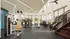 Modern apartment gym with state-of-the-art exercise equipment, sleek design, and large windows offering natural light.