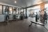 Modern fitness center equipped with state-of-the-art exercise machines and ample natural light.