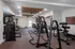 Modern fitness center with state-of-the-art gym equipment, spacious layout, and stylish decor.