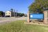 Inviting entrance of University Square Apartments with well-maintained landscaping and modern signage.