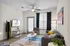 Modern living room featuring elegant furniture, a vibrant rug, and natural lighting, creating a welcoming and stylish atmosphere.
