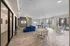 Elegant indoor lounge area with modern seating, stylish lighting fixtures, and large windows offering natural light, perfect for relaxation and social gatherings.
