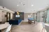 Chic apartment clubhouse with a modern lounge, vibrant pool table area, and large windows providing a light-filled environment.