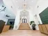 Inviting apartment lobby with modern lighting, elegant wooden staircase, and stylish decor accents.