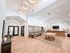 Modern communal lounge with elegant lighting, cozy seating, and a stylish pool table for entertainment and relaxation.