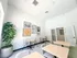 Bright and modern dining area with elegant tables, comfortable chairs, and vibrant wall art, ideal for communal gatherings.