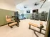 Modern fitness center with state-of-the-art cardio machines, strength equipment, and ample space for workouts.