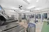 Modern fitness center featuring state-of-the-art treadmills, weight machines, and sleek design perfect for a dynamic workout.