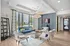 Chic and inviting apartment lounge with modern furniture, elegant lighting, and a vibrant color scheme, overlooking city views.