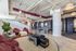 Chic recreational lounge featuring contemporary design with comfortable seating, playful bean bags, and an Atari Pong table.