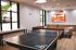 Sparq-on-Rio-Apartments-Near-UT-Austin-Resident-Clubhouse-Game-Room-Ping-Pong
