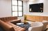 Sparq-on-Rio-Apartments-Near-UT-Austin-Resident-Clubhouse-Lounge-Seating-and-TV