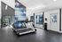 Bright and modern fitness center with treadmills, exercise equipment, and motivational wall decor.