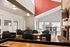 Inviting lounge area with cozy seating, modern decor, and abundant natural light, perfect for relaxation and entertainment.