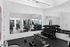 Modern apartment gym with state-of-the-art fitness equipment, mirrored walls, and ample free weights.