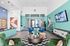 Stylishly decorated modern lounge with colorful seating, geometric patterns, and sleek furniture.