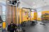 Bright and modern fitness center with state-of-the-art equipment, including weights and cardio machines.