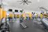 Spacious and modern gym facility with top-tier equipment, featuring an array of strength and cardio machines.