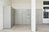 Modern package locker system integrated into apartment building design.