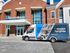 Inviting apartment leasing office with vibrant shuttle promoting Aspen Heights, offering modern apartments tailored for you.