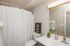bathroom sink, shower, and toilet
