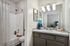 bathroom sink and separate toilet and shower