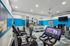 fitness center with cardio and weight machines and free weights