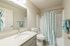 bathroom sink, shower, and toilet
