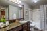 Arrive on University Bathroom with Granite Countertops and Large Mirror