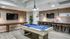 Game room with pool table, shuffleboard, and seating